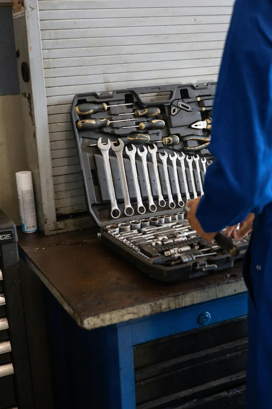 Field technician inspecting equipment with documentation
